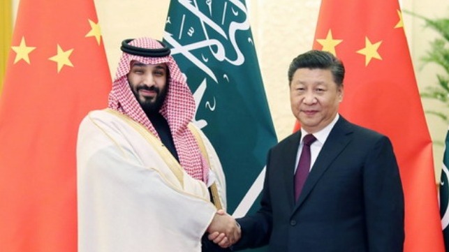 Chinese President Xi Jinping (R) meets with Mohammed bin Salman Al Saud, Saudi Arabia's crown prince, at the Great Hall of the People in Beijing.