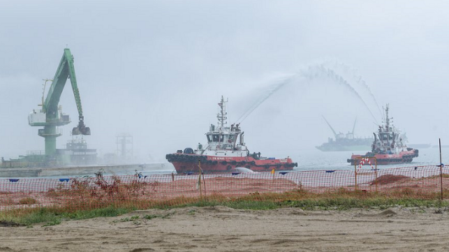 Filling of dredged materials into the final caisson to lock its position.