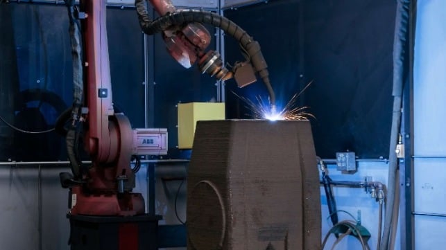 A Lincoln Electric 3D metal printing machine builds up a replacement lever arm for the Poe Lock (USACE)