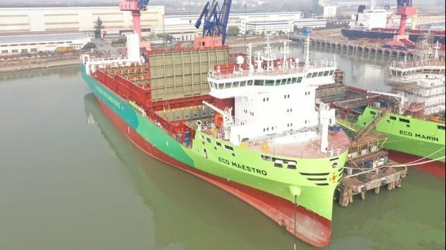 Two of X-Press Feeders' new green-methanol-powered boxships, in green livery (X-Press Feeders)
