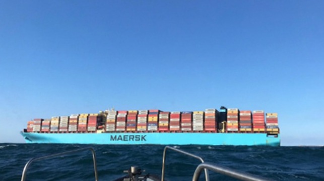 disabled container ship towed after fire