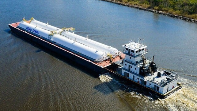 Southern Devall towboat and a tank barge on a river 