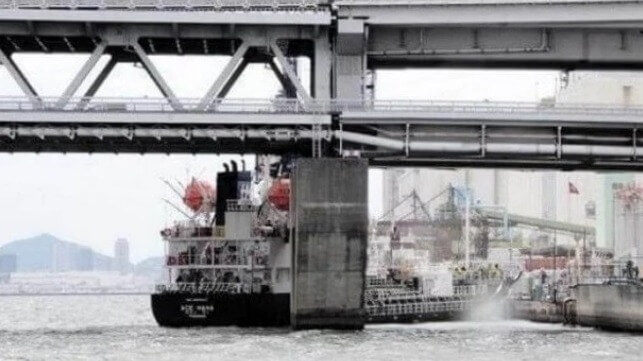 tanker stuck under bridge