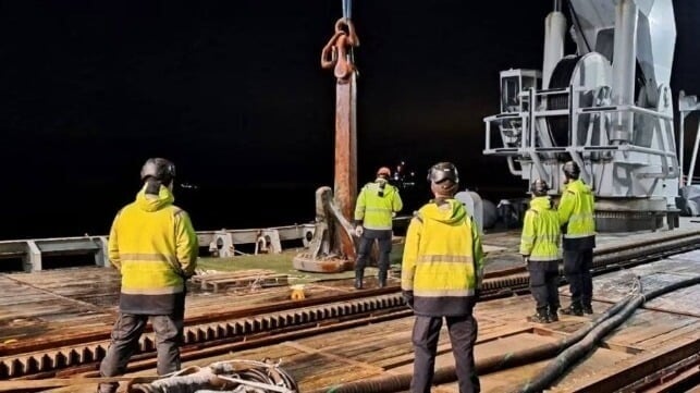 Eagle S's lost port anchor, retrieved and lowered to the deck of a Swedish salvage ship (Finnish Border Guard)