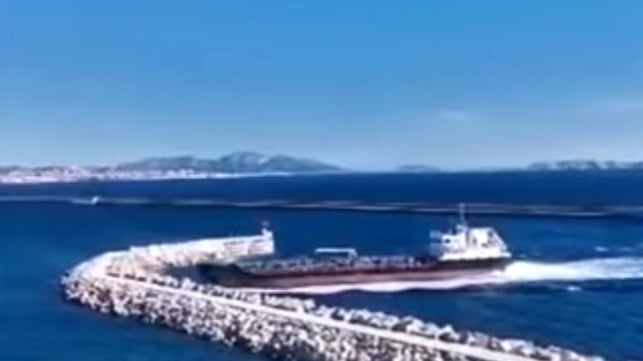 French oil supply ship sailing into a breakwater outside Marseille France