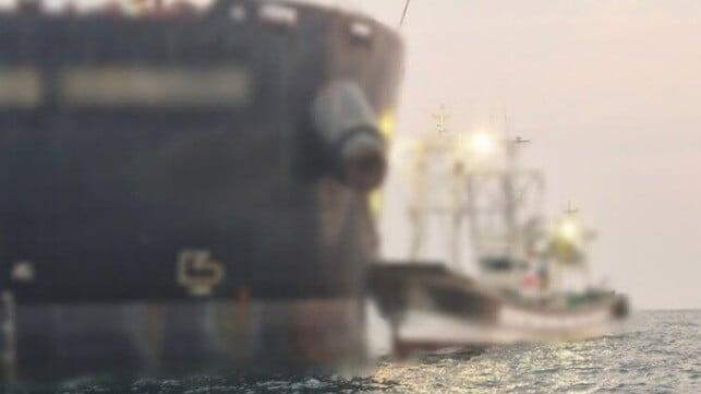 cargo ship and fishing boat