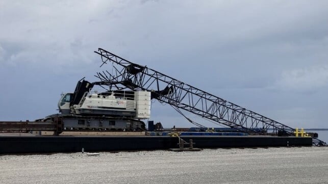 broken crane boom after bridge strike