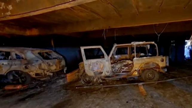 Burned-out Jeep Wrangler fitted with steel push bumper, Deck 10, Grande Costa D'Avoria (Courtesy AFT / USCG)