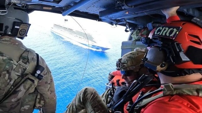 Air Force pararescuemen get ready to medevac a young boy in need of medical care from the cruise ship Carnival Venezia, May 4 (USAF)