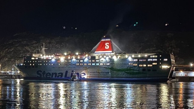 Ferry Stena Europe at port at night with fire hoses spraying at her stack
