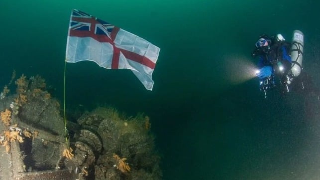 White ensign raised over wreckage of HMS Exmouth