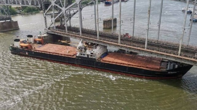 Russian cargo ship under bridge