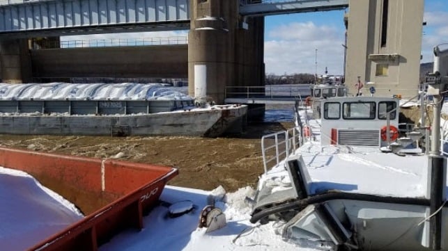 Stern of barge C508 after colliding with Corps of Engineers workboats Emsworth (foreground) and Dashields (background). (Photo by U.S. Coast Guard)