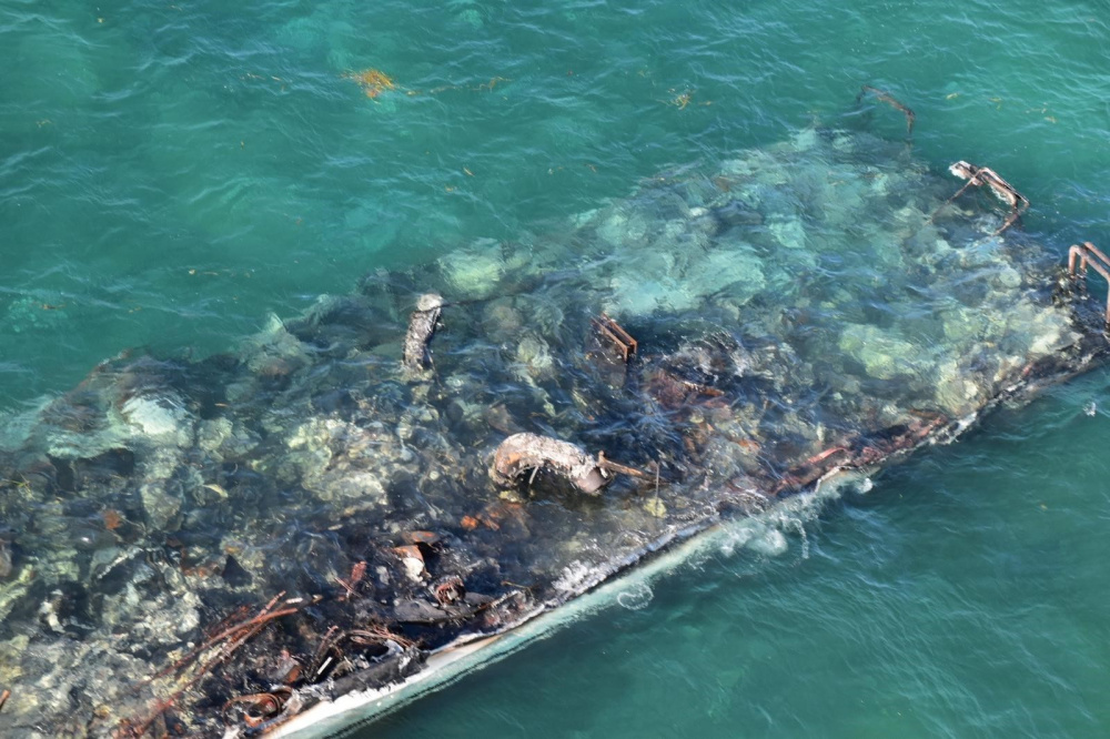 Photos: Cleanup Under Way After Yacht Burns as well as Sinks off Key West