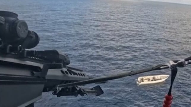 A Coast Guard sniper disables a drug boat's engines with a .50-caliber rifle (USCG)