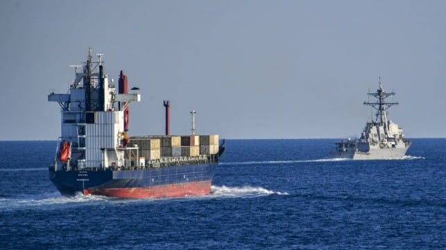 A U.S. Navy destroyer escorts a merchant ship through the Strait of Hormuz in quieter times (USN file image)