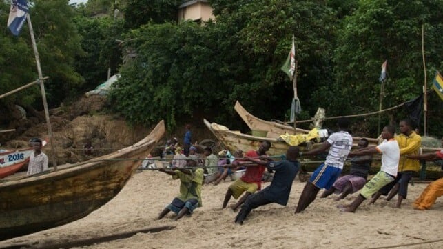 Ghanaian fishermen haul up their boats onto the beach (File image courtesy EJF)