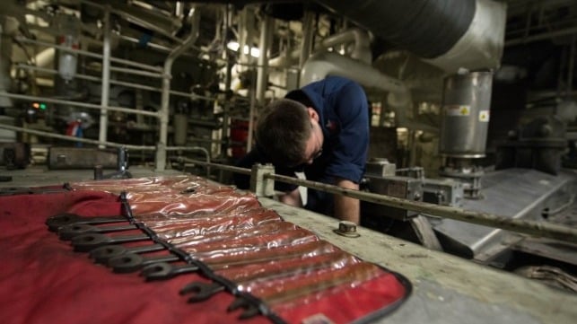 A Navy sailor attempts to make repairs aboard the LCS USS Freedom while deployed overseas, 2013 (USN)