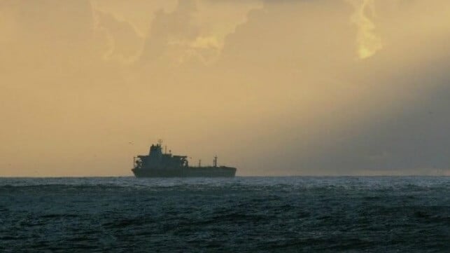tanker sailing into the sunset