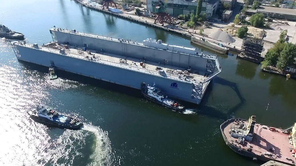 The process of building a caisson using a floating dock. Adapted